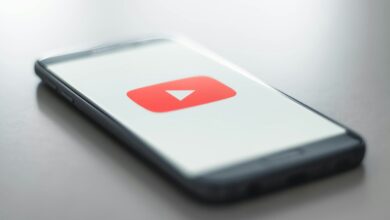 a close up of a cell phone with a youtube logo on it